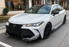 Toyota-Avalon-luxury-sedan-parked-on-city-street