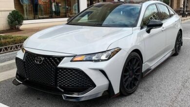 Toyota-Avalon-luxury-sedan-parked-on-city-street